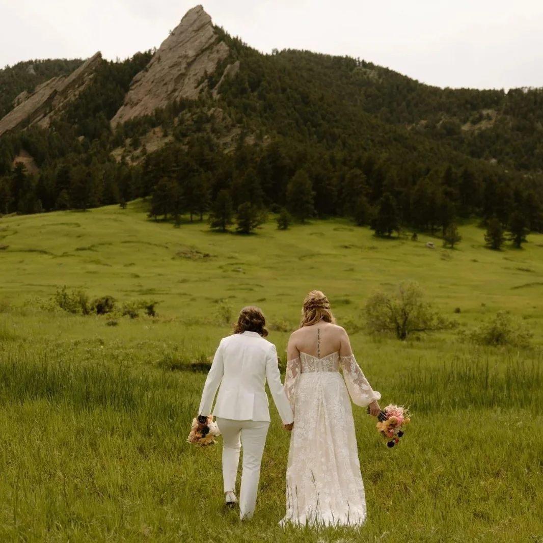Couple embracing at a mountain overlook after their vows
