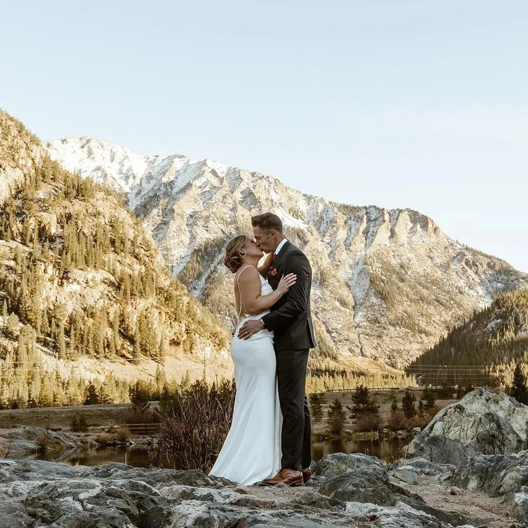 Joyful newlyweds celebrating in the Rockies